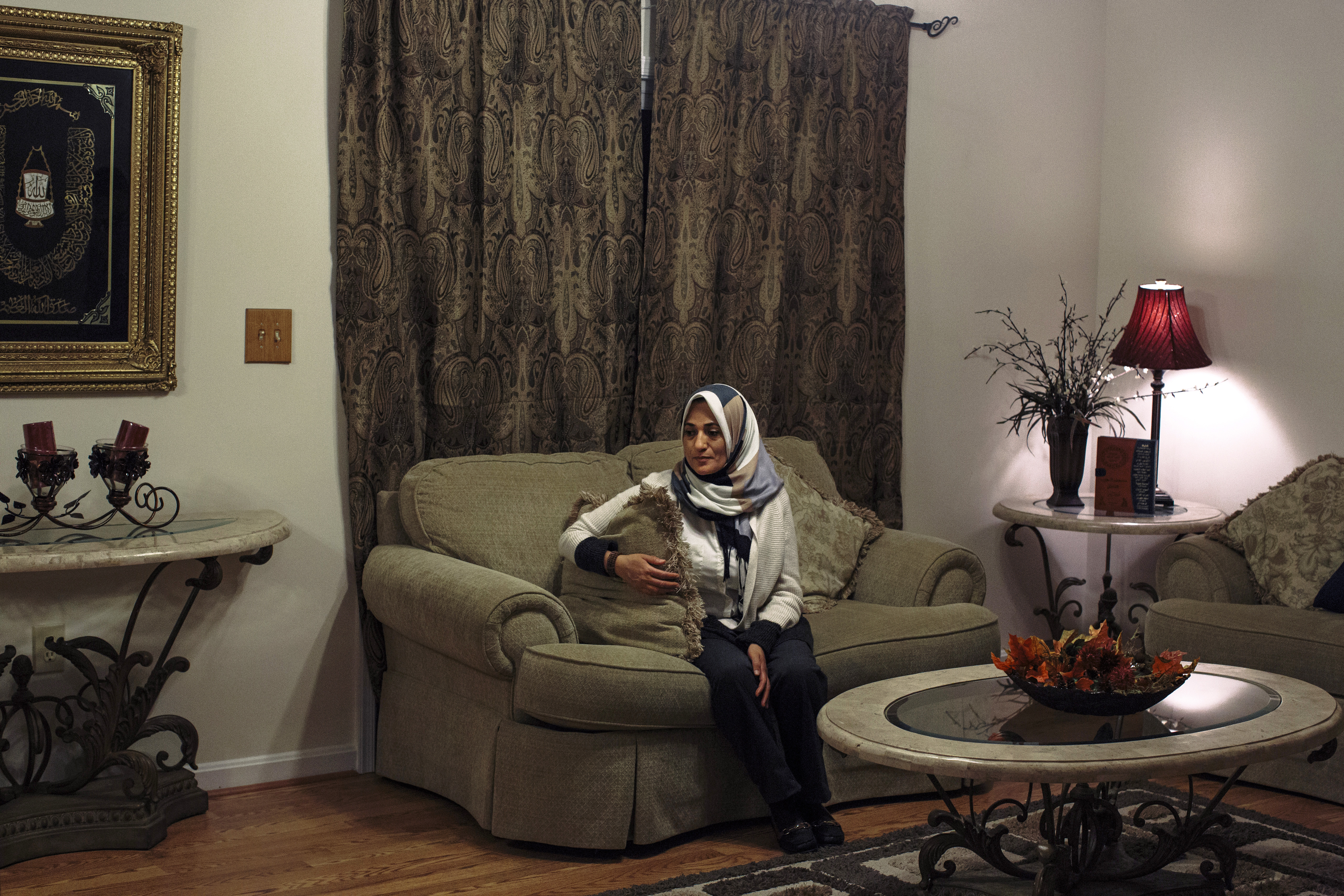 Sanaa Soliman sits in the living room of her home in Fredericksburg, Va. on Dec. 19, 2015. Sara and Mohamed Shanab are afraid for their mother, who wears a hijab. Sara bought her mother pepper spray. “I see my mother. Everyone else sees a terrorist,” Mohamed says.