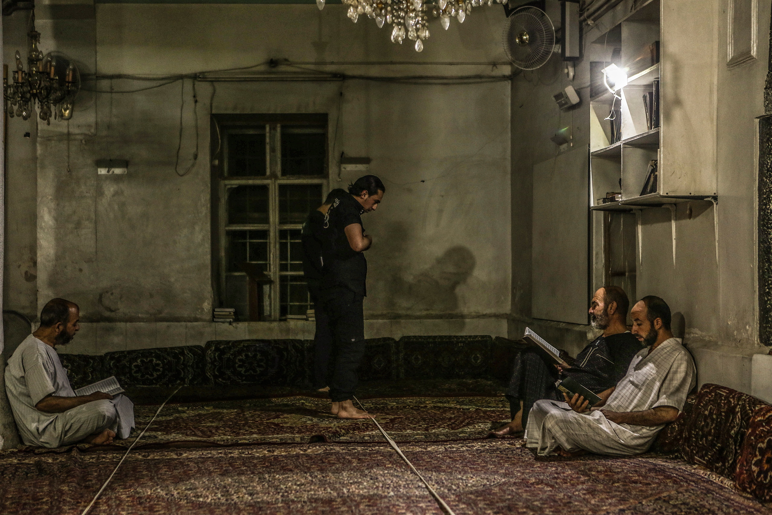 Men pray in a mosque in Eastern Ghouta province on July 2. Mohammed Badra—EPA