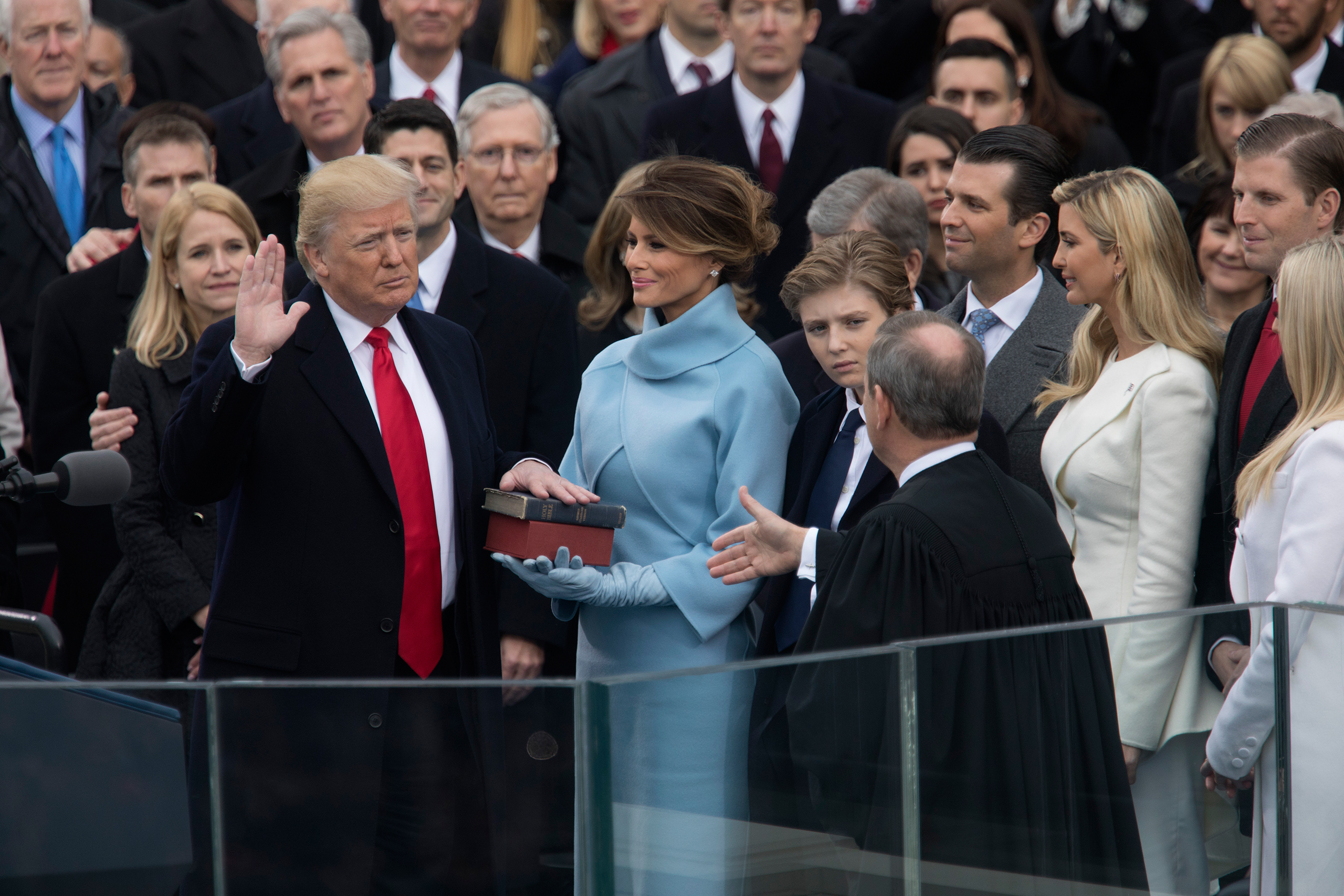 President Donald Trump takes the oath of office alongside his wife, Melania, at the Capitol in Washington on Jan. 20, 2017.