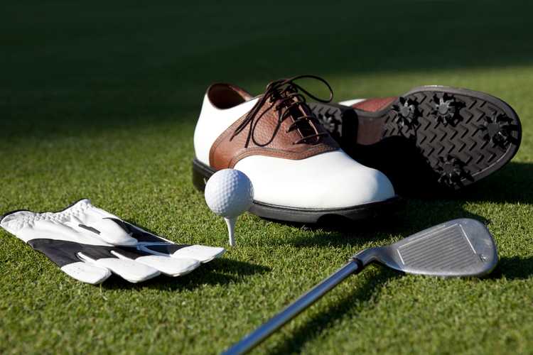 Golf Shoes, Gloves,Ball,Club On Green Grass