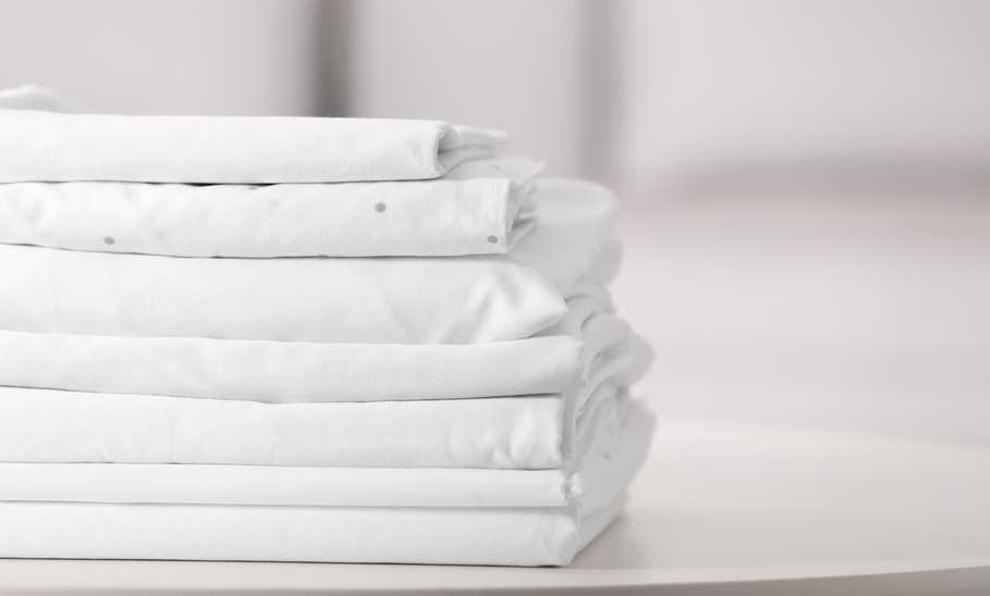 clean folded bed linen sheets