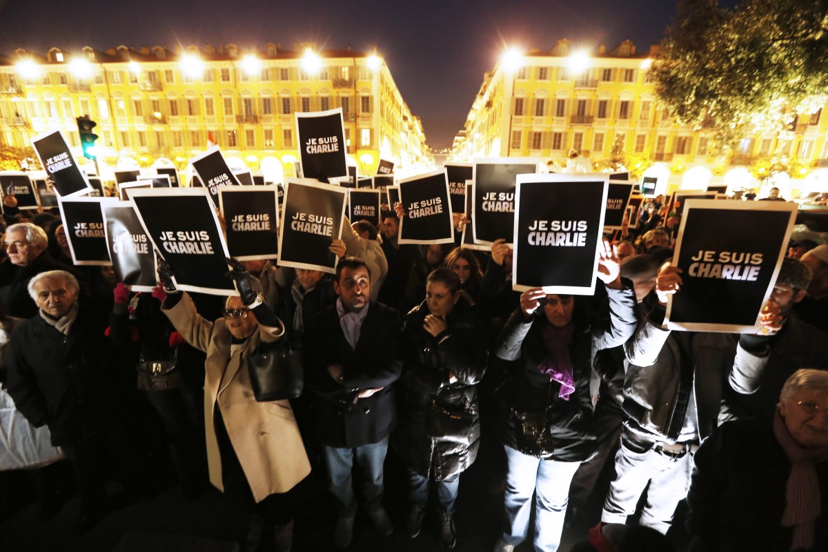 People hold up placards reading "I am Charlie" during a gathering in Nice on Jan. 7, 2015, in support of the victims of a terrorist attack on French satyrical newspaper Charlie Hebdo.