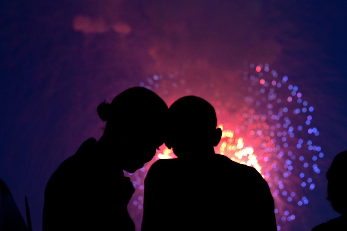 Barack Obama and Michelle Obama watch the fireworks over the National Mall from the roof of the White House, July 4, 2010.