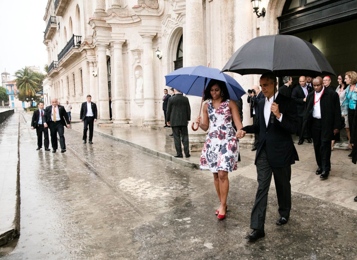 Barack Obama and Michelle Obama walk to the motorcade after touring Old Havana, Cuba, March 20, 2016.