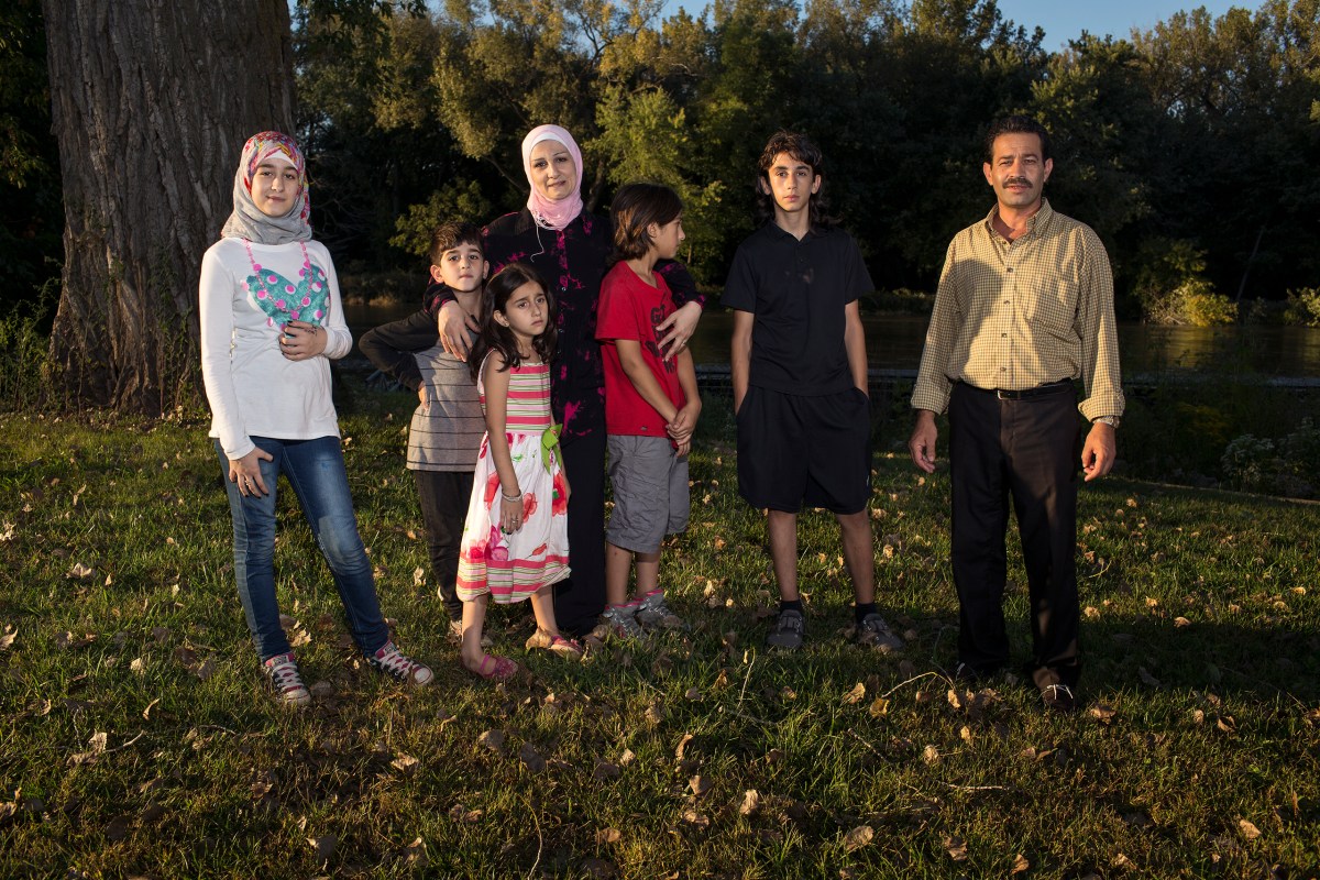 Ghazweh and Abdul Fattah at a park in Des Moines with their children, from left to right: Sedra, Mutaz, Hala, Haidar and Nazeer.
