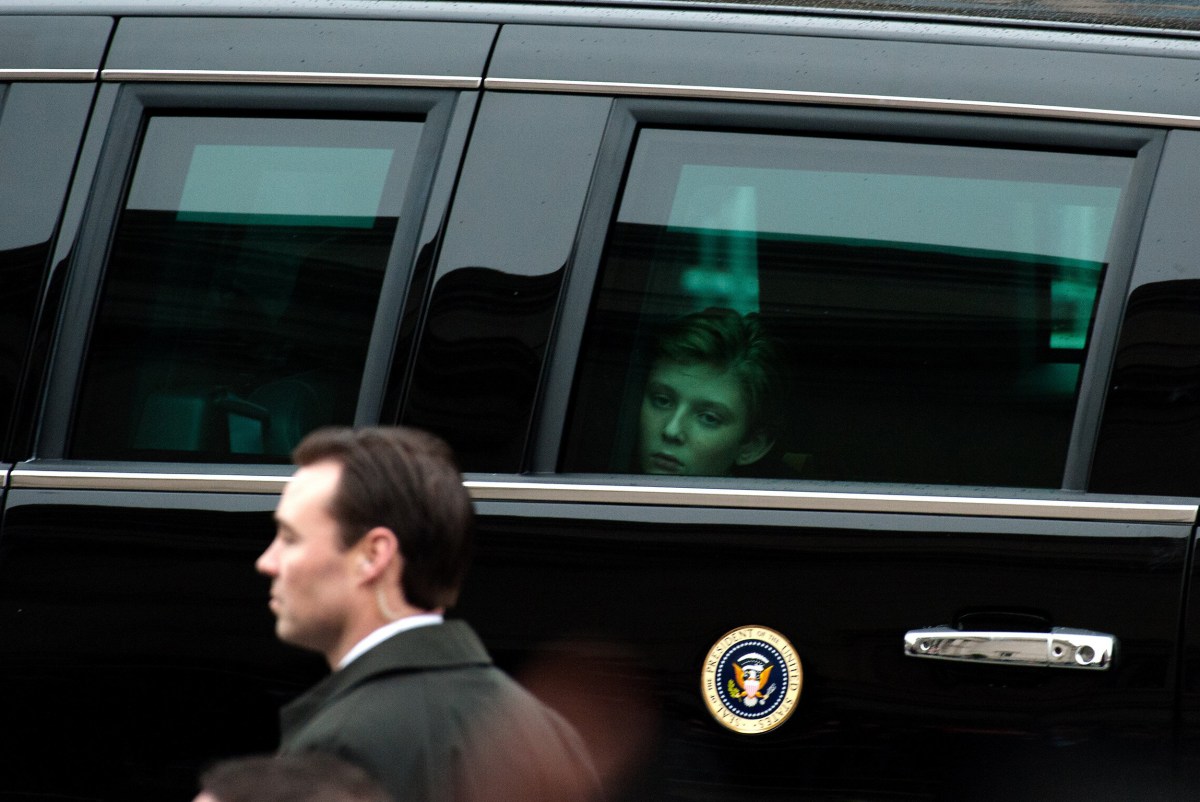 Barron Trump, the president's youngest son, looks out a limousine window during the inaugural parade in Washington on Jan. 20, 2017.