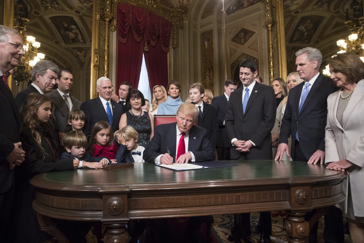 President Trump is joined by the Congressional leadership and his family as he formally signs his cabinet nominations into law in the President's Room of the Senate in Washington, D.C., on Jan. 20, 2017.