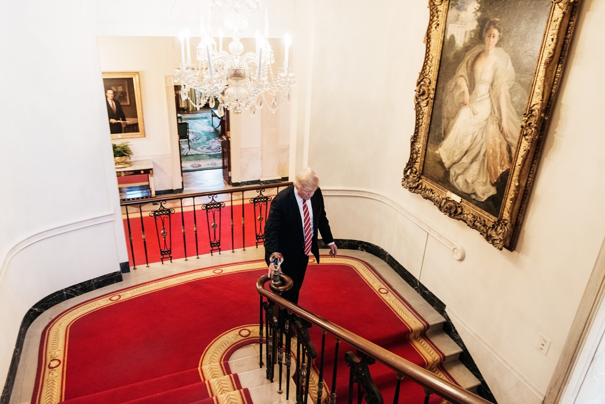 President Trump walks down the Grand Staircase. Benjamin Rasmussen for TIME
