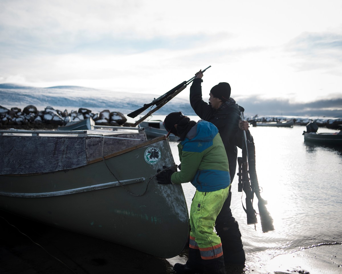 Nanasi and Markoosi, residents of Clyde River, getting ready to go out Norwhal hunting. 