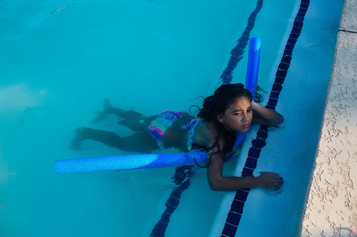 Layla plays in the community pool near her grandmother's home. Sara Naomi Lewkowicz for TIME
