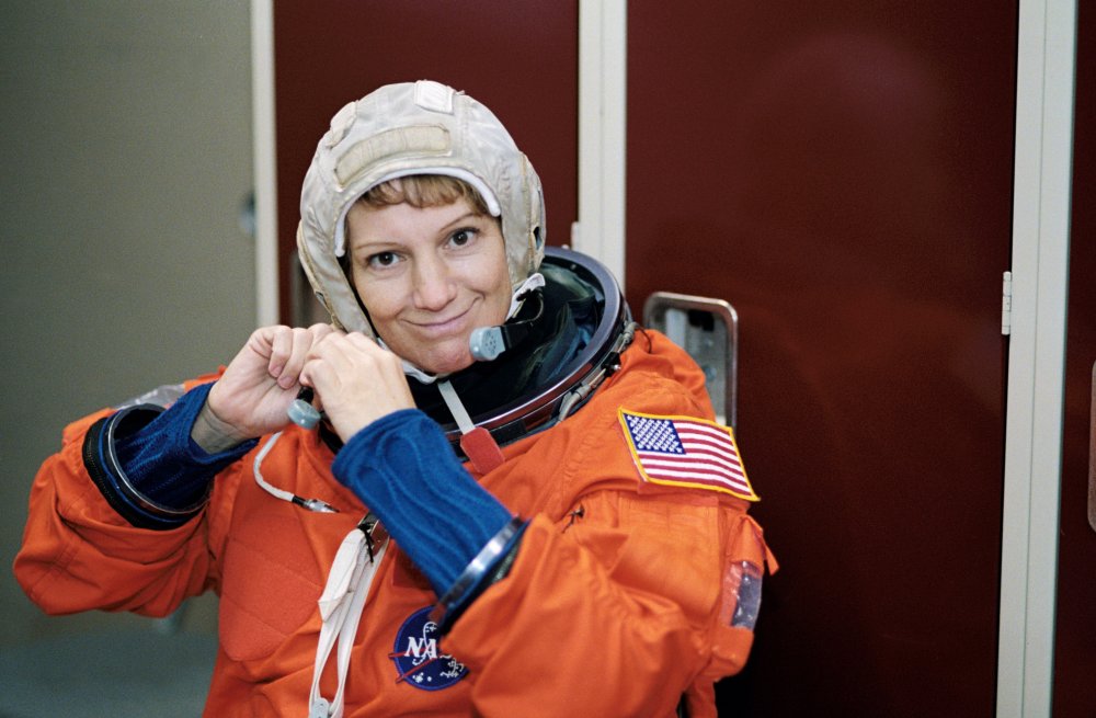 Eileen Collins participating in emergency egress training at Johnson Space Center&#039;s Shuttle mockup and integration laboratory, November, 2002.