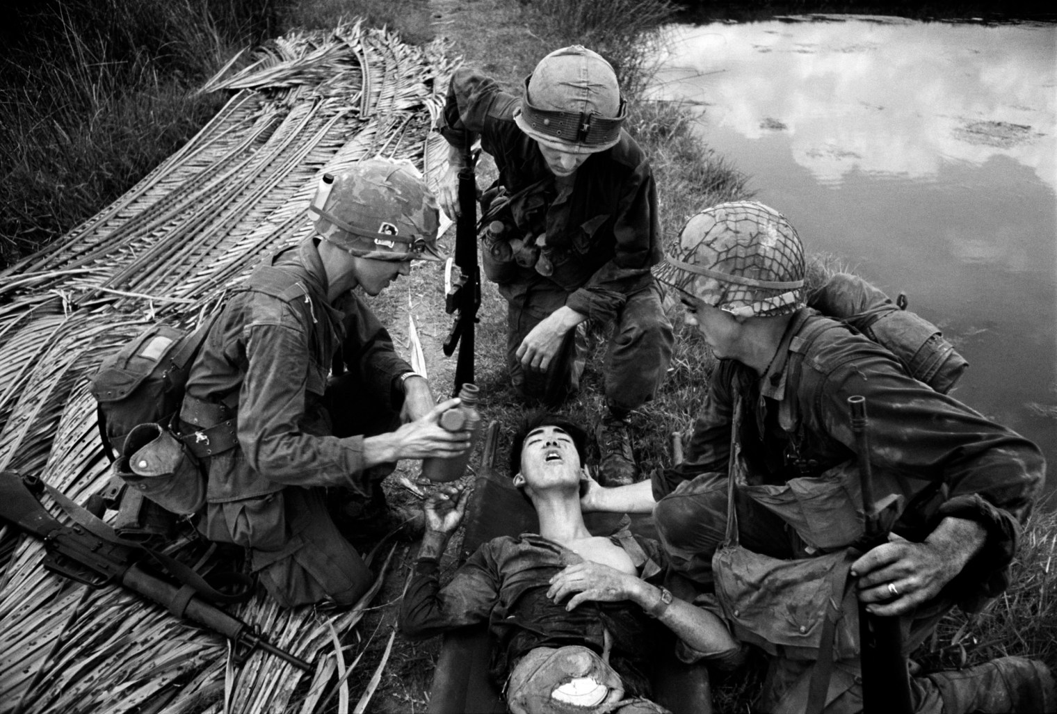 VIETNAM. The battle for Saigon. American G.I's often showed compassion toward the Vietcong. This sprang from a soldierly admiration for their dedication and bravery; qualities difficult to discern in the average government soldier. This VC had fought for three days with his intestines in a cooking bowl strapped onto his stomach. 1968