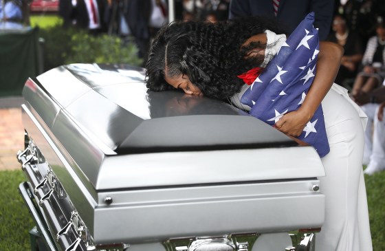 Myeshia Johnson kisses the casket of her husband killed in Niger