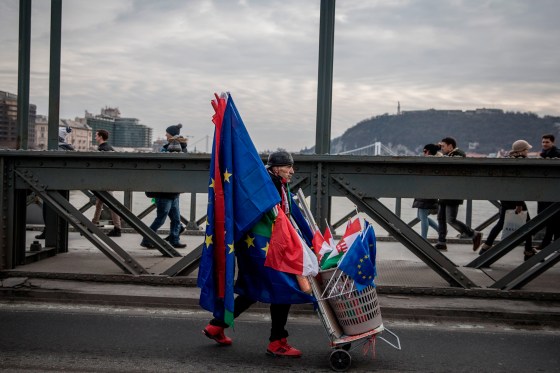 A man sells both Hungarian and E.U. flags in Budapest at a January protest against Orbanâ€™s government