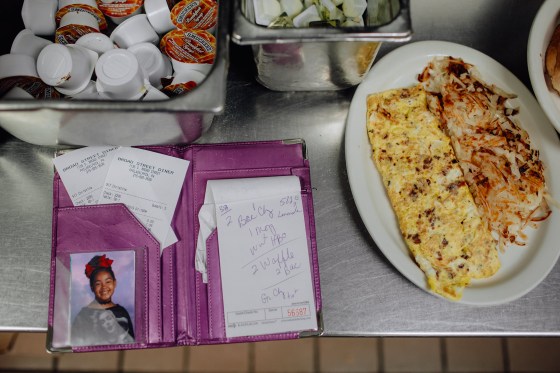 n the kitchen at the Broad Street Diner in Philadelphia, waitress Christina Munce keeps her daughterâ€™s photo next to her padÂ for taking orders.
